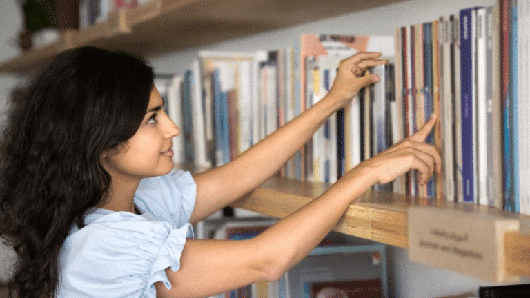 Textbooks: Truth or Propaganda? How Stories like the Comfort Women, Tiananmen Square, and the Houthi Rebellion Are Told to Young Minds Focused woman choosing a book in a university library, exploring materials related to Anti-Japan Tribalism and historical studies